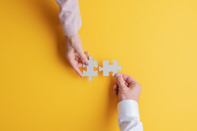 puzzle and hands