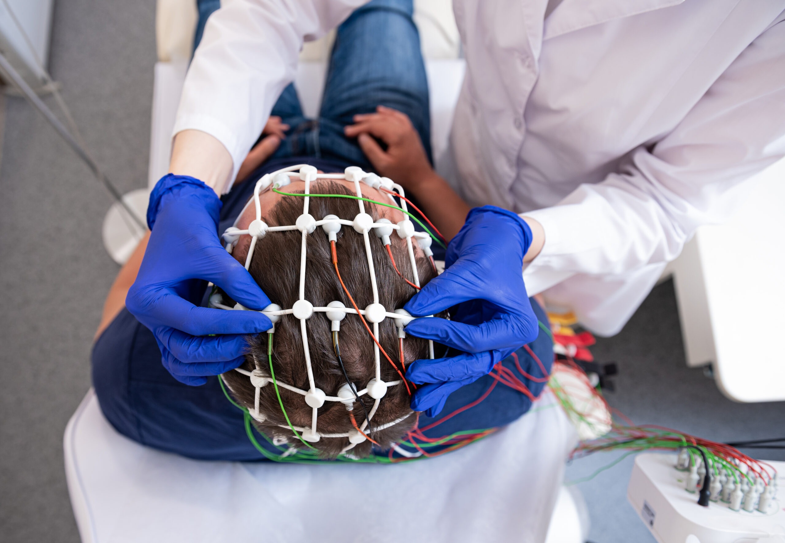 Patient brain testing using encephalography at medical center