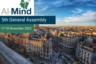 Crossing and buildings in Madrid and the AI-Mind logo with the text 5th General Assembly