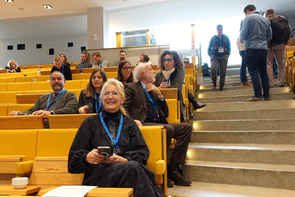 Audience of the meeting, people smiling