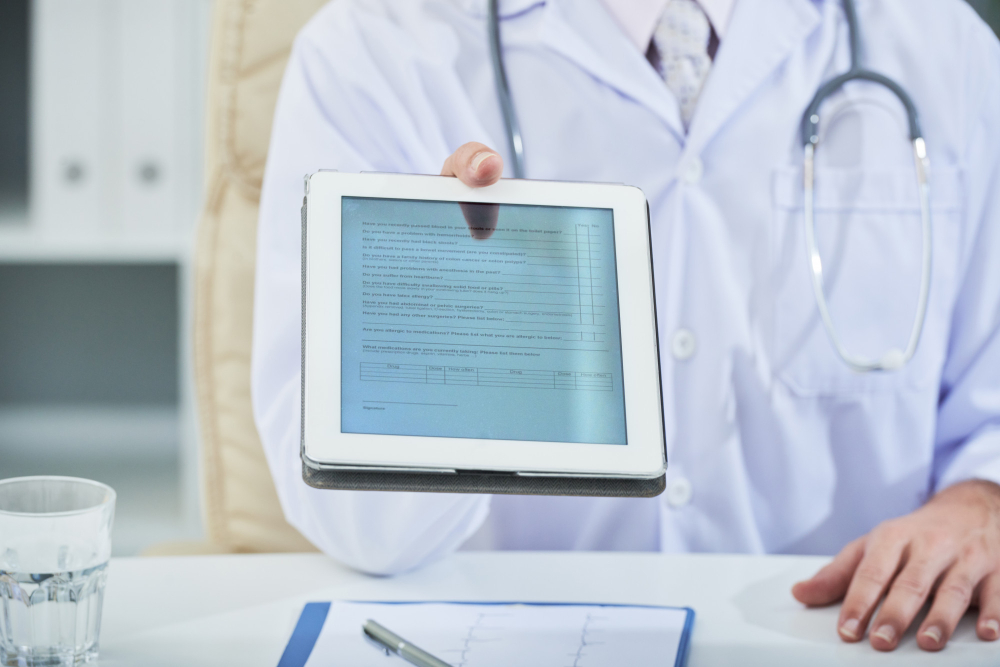 doctor holding tablet