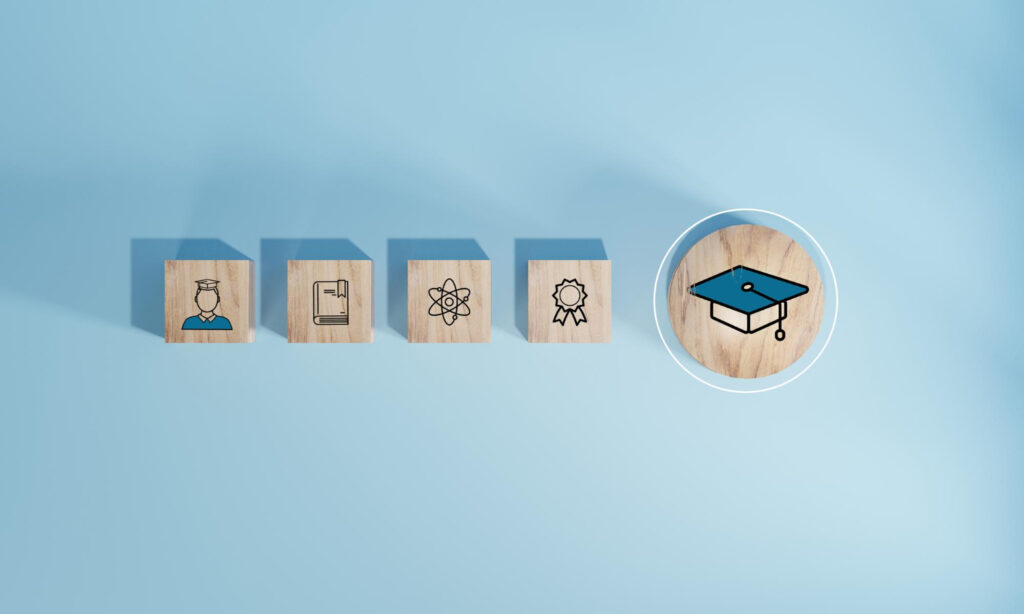 Student icons on wooden blocks Education concept