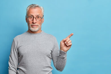 elderly person pointing